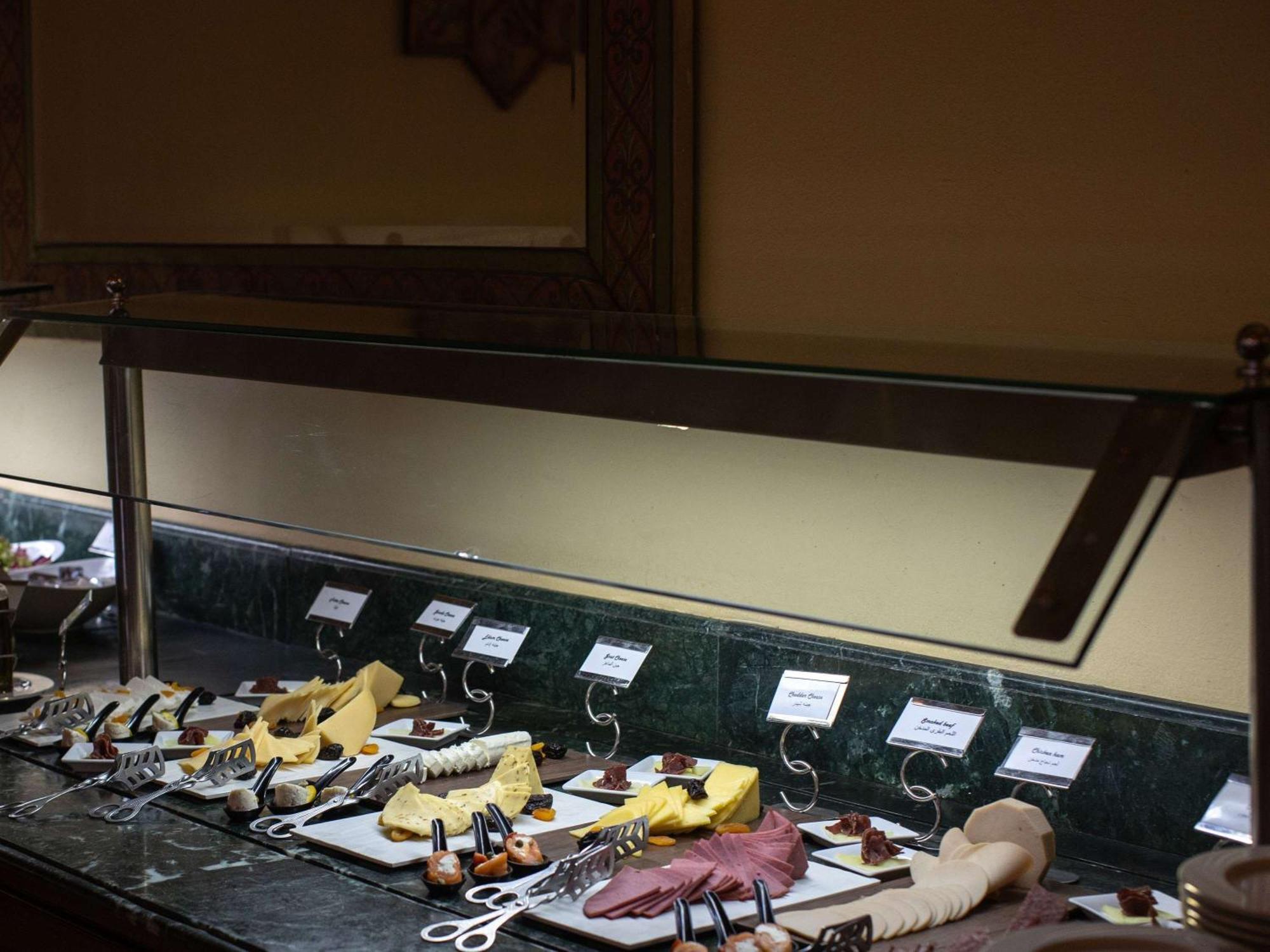 Pavillon Winter Luxor Hotel Bagian luar foto A cheese display at a buffet